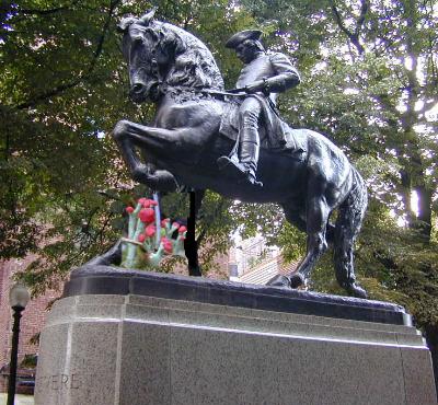 statue of Paul Revere's horse stomping British Soldier lichens